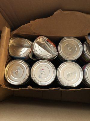 Damaged can cat food cans