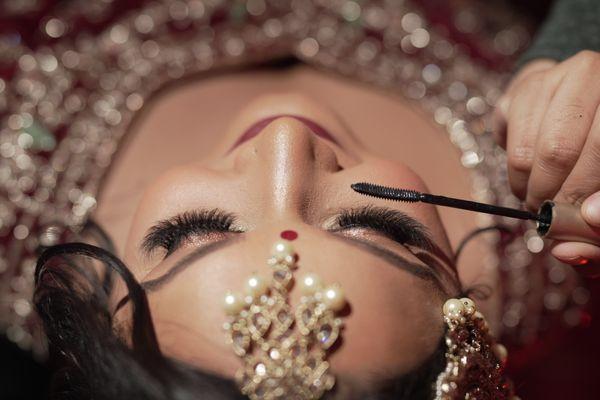 Indian bride getting makeup