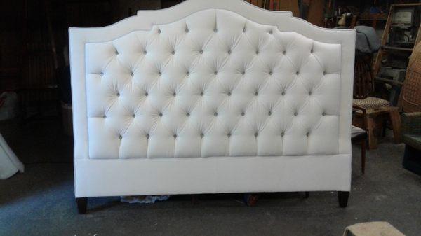 This is a king size headboard I reupholstered for a client . I also custom build headboards and upholstered beds.