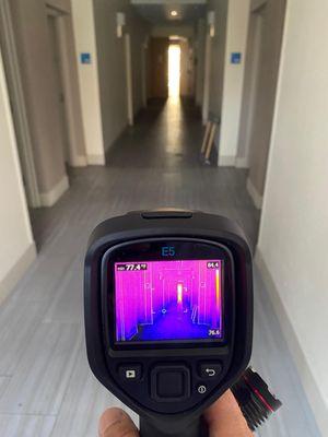 We use infrared thermal imaging to detect moisture.