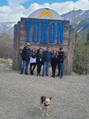 Family photo at Yukon Sign with lovely Ella