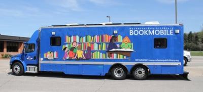 2012 bookmobile features green technology: a hybrid drive train, solar panels,Carries about 4,500 items.