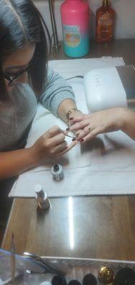 Manicurist Destiny Padilla doing a fantastic job