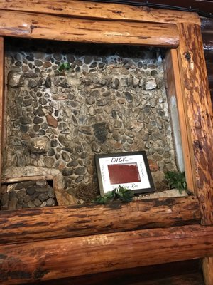 Defunct water fall with a shadow box of the previous carpet