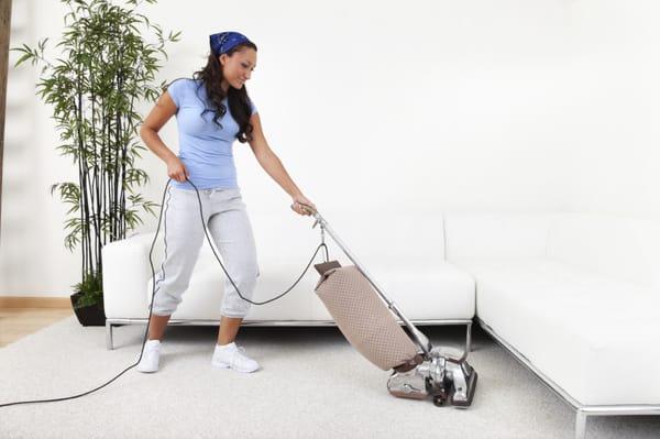 Maid vacuuming