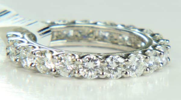 To-order 18kt white gold shared prong diamond eternity ring