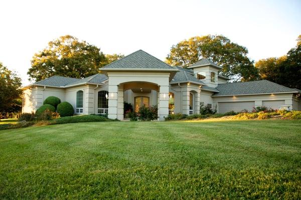 This lavish home incorporate so many distinctive architectural details such as arched windows, coffered ceilings, custom buil...