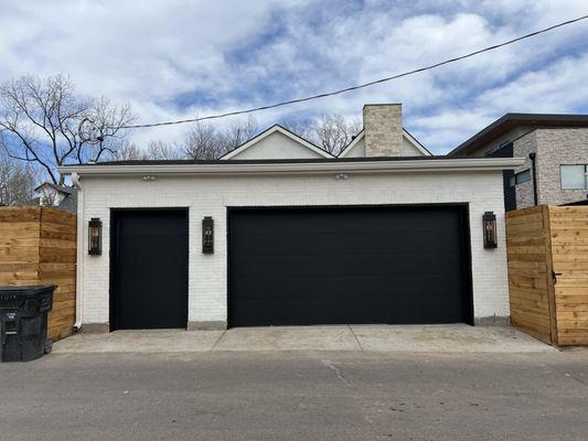 painted garage doors black and brick white.