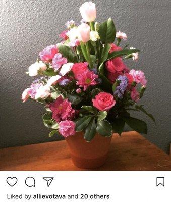 Another picture of what my coworker received. Less than 50% of the flowers that were in the arrangement I ordered.