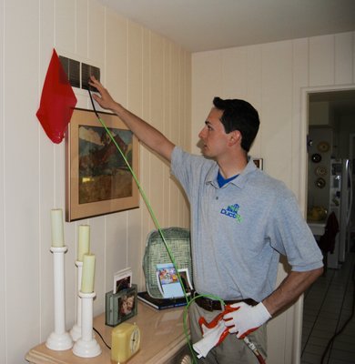 Aric, one of our indoor air quality technicians, checks to ensure that the whole system is under suction so that contaminants are removed