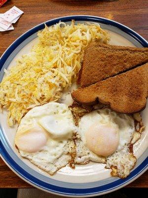 Two eggs, hash browns and toast.