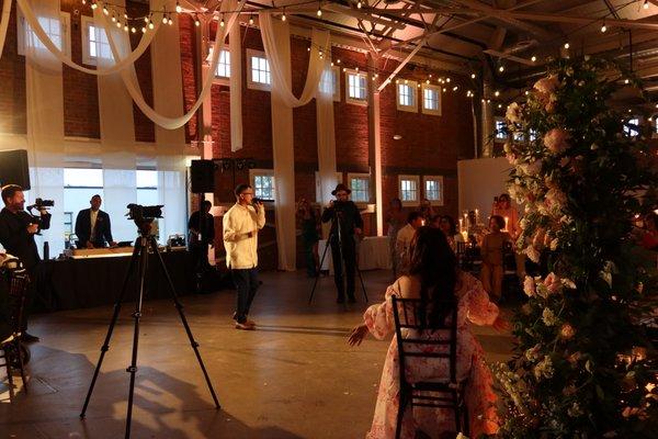 That's me, the groom singing live with a live guitar and piano thanks to Deondre!  Surprising my now wife!  She had no idea. :)