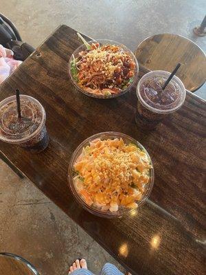 Hula Bowl and a custom bowl with brown rice, salad, spicy chicken and toppings.