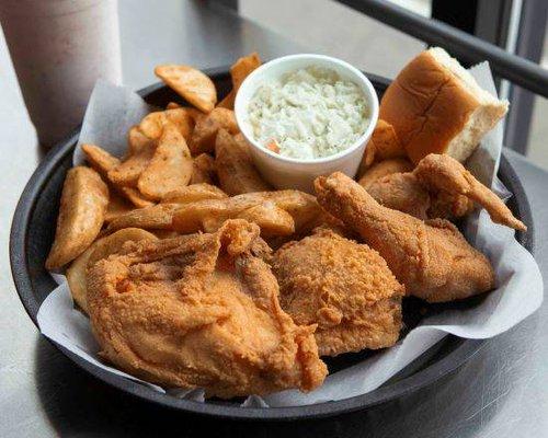 Broasted chicken is prepared in a pressure cooker, resulting in a crispy exterior and juicy interior.