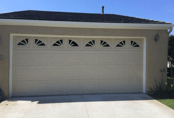 AFTER: The garage door is now fixed and straightened.