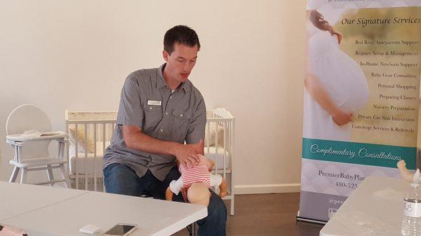 Dad Prep Coach, Brent teaching life saving techniques through Infant CPR and Safety to a group of expectant parents.