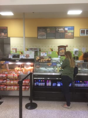 A happy customer about to get wowed by a buffalo tender sub.