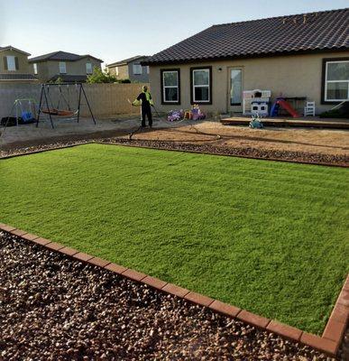 Beautiful Artificial Grass and Paver Border Installation. With Gravel laid and spread around. :)