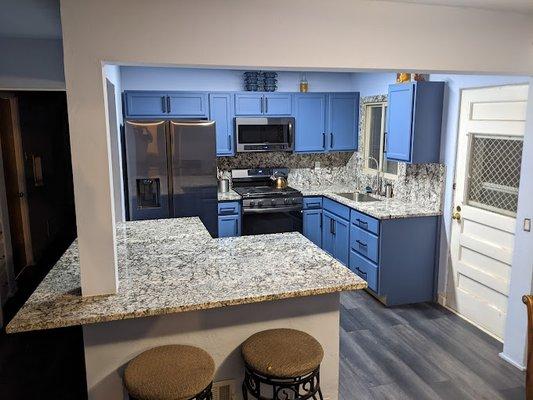 Bran new blue flower granite counter tops in small and unique kitchen