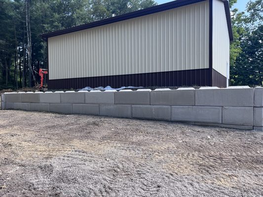 2'x2'x6' Concrete block 
Used for retaining wall and set with a mini excavator.