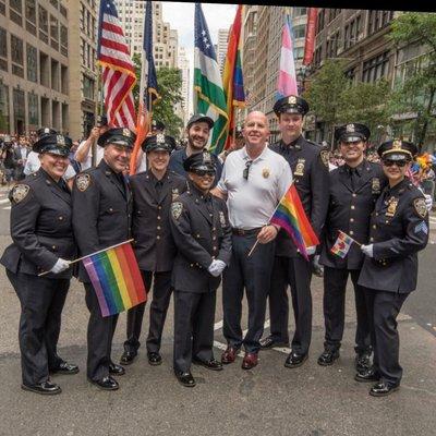 William Shepard, Esq (center with hat) attends the Pride March along with NYPD Officers and Executive Staff