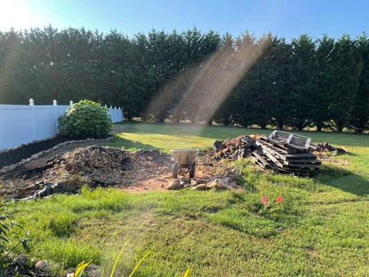 Rocks and Garbage left in yard that was supposed to be cleared. They did take the pallets.