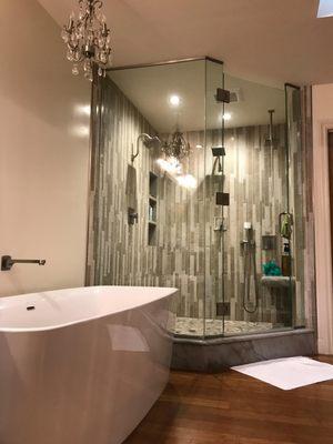 Remodeled bath with vertical tile for shower walls