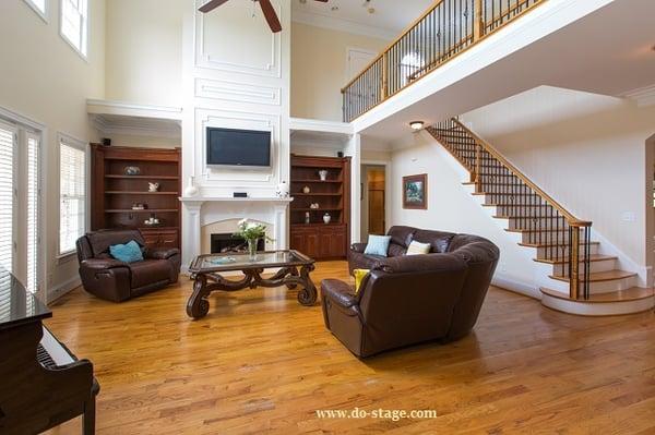 'After' of Occupied Staging of family room by DO STAGE LLC.