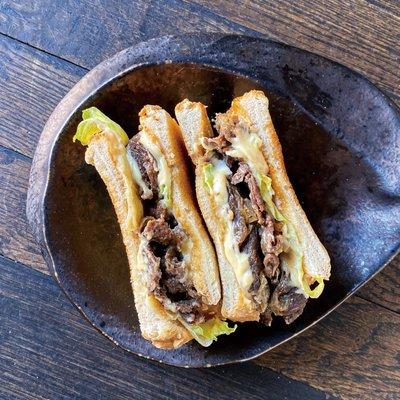 Japanese-American Philly cheese Steak - 
Very rich, savory and juicy grilled beef marinated with rich Japanese mayo based Sandwich