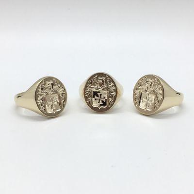 Hand engraved die struck signet rings.