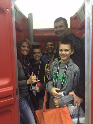 Whole family in a portable toilet at the pumper show