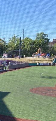 Along left field, Full bar in back and local pizza to left