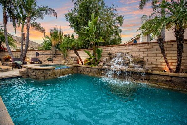 Pool and spa with running waterfall system.