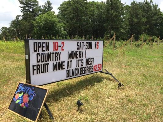 Roadside sign with hours