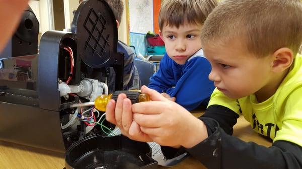 Taking a computer apart in the Makerspace.