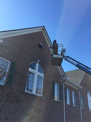 Technician Changing a Wall Pack