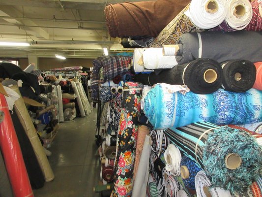 Full floor of apparel fabrics: linen, silk, cotton, wool, poly, etc.