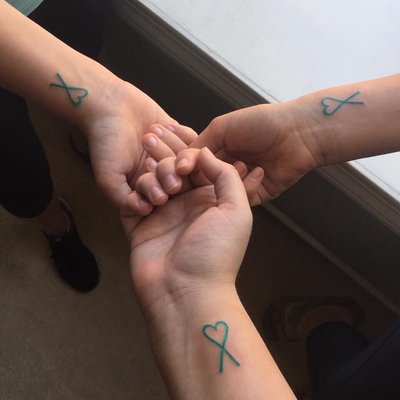 Got ovarian cancer ribbons with a heart done by Wes