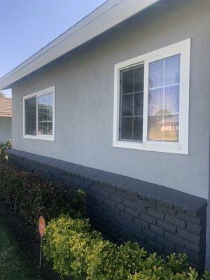 After. Neutral Wave for the stucco, Iron-IC for the brick (front of house and chimney), and Sugar Swizzle for the fascia, fence, and gate!