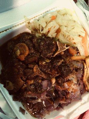 Oxtails, cabbage, purple cabbage, and plantains.