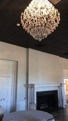 Chandelier and fireplace