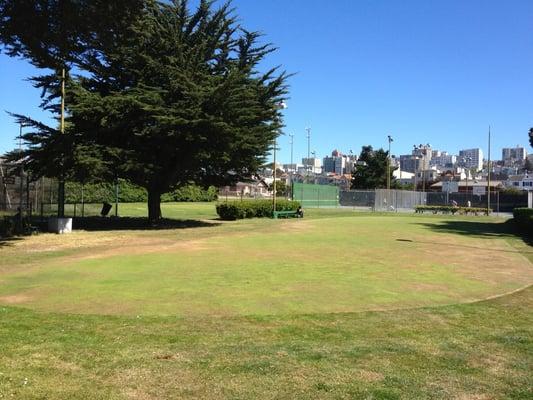 Putting green and chipping green behind it