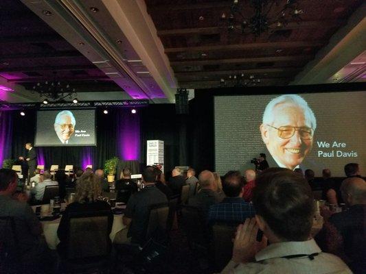 Mr. Paul Davis on the screen at the Paul Davis Restoration National Conference 2018