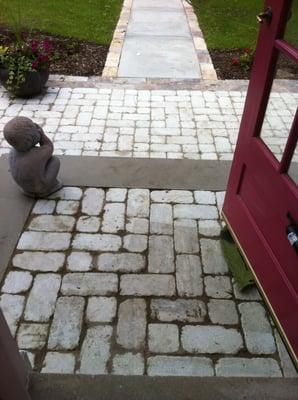 The first picture is the stoop installed with broken stones, this one is his "fix" - but didn't have any 4x4 - no pattern.