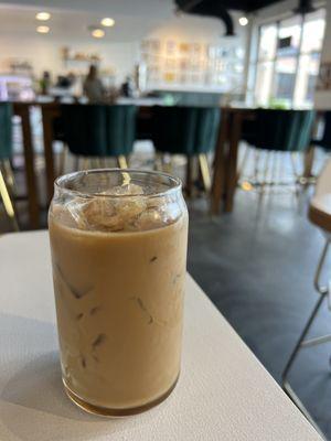 Iced vanilla latte with oat milk