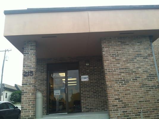 Front entrance faces the armory across the street & parking lot.