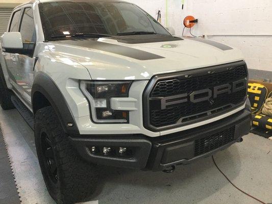 2017 Ford F150 Raptor getting Xpel paint protection and ceramic coating along with custom painted trim, flares and bumpers.