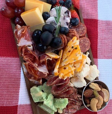 Signature charcuterie board with a tantalizing medley of meats & cheeses from Amazing Graze.