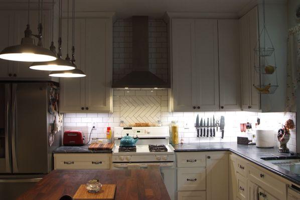 Especially like the herringbone inset above the stove.