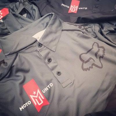 We can decorate your shirts or ours. These Fox shirts were brought to us to add the Moto United logo on them.